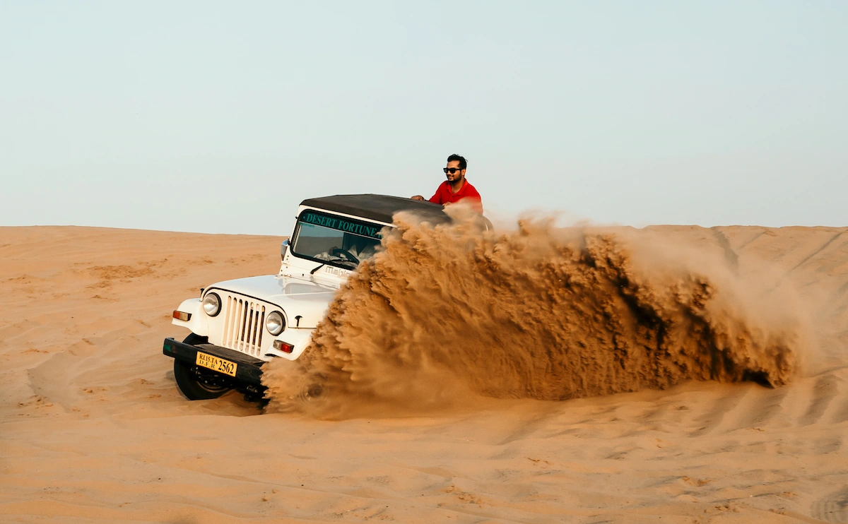 Camel and jeep safari at sunset in Sam Sand Dunes Jaisalmer