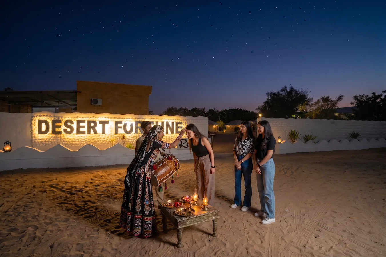 Traditional dhol and tika welcome at Desert Fortune Resort camp gate