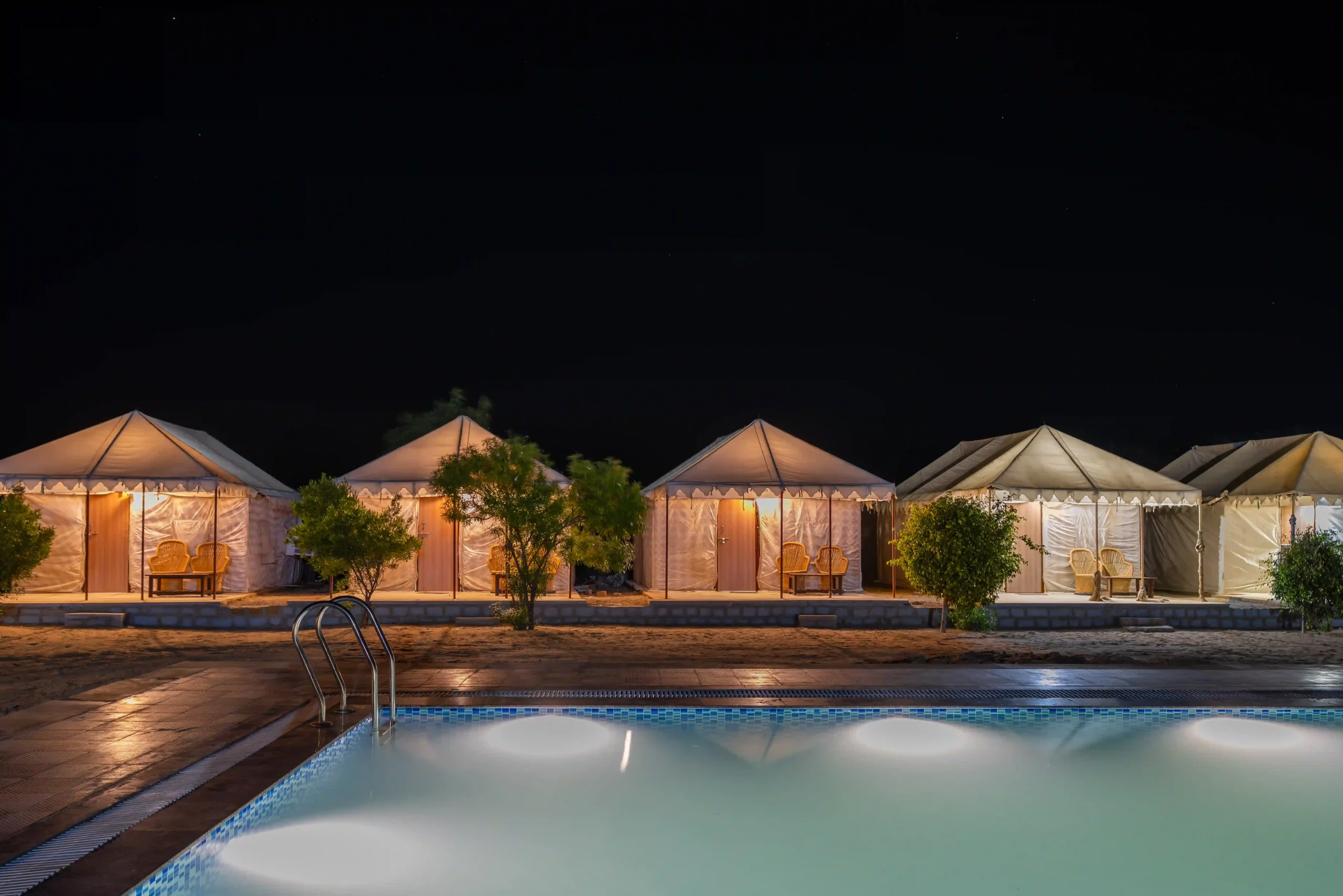 Starry night sky over luxury Swiss tents at Desert Fortune Resort